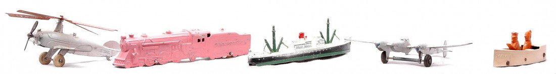 TootsieToy 4659 P38 1038 PRR Loco/Tender: TootsieToy 4659 autogyro, a P-38 airplane, 1038 freighter, 5106 Uncle Willie boat and a Pennsylvania loco and tender. The PRR loco and tender appear to have been repainted. The accessories show modera