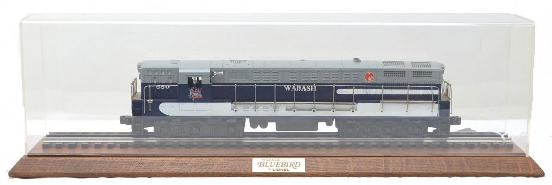 Lionel 28307 Wabash FM Train Master CC w/Board: Lionel 28307 Wabash FM Train Master Command Control diesel with an oak display board that has a Wabash Bluebird plaque and plastic cover. The loco has been test run, C9.