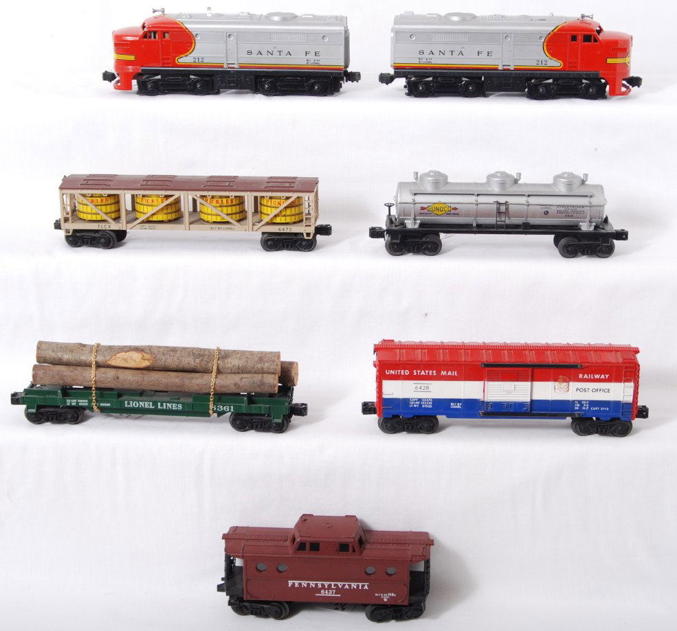 Lionel 212 S.F., 6475, 6361, 6415, 6428, 6437: Postwar Lionel O gauge 212P and 212T Santa Fe Alco diesel A units with 6475 Pickles vat car, 6361 lumber car partially missing a step, 6415 Sunoco tank partially missing a step, 6428 RPO car missing s