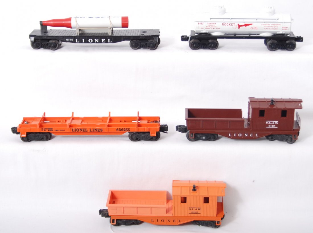 Lionel 6463, 6362, 6175, 6119, 6119-25: Postwar Lionel O gauge 6463 Rocket Fuel tank, 6362 wheel truck car, 6175 flatcar with rocket, 6119 Delaware, Lackawanna, and Western work caboose, and 6119-25 D.L.&W. work caboose, trains are unrun C8