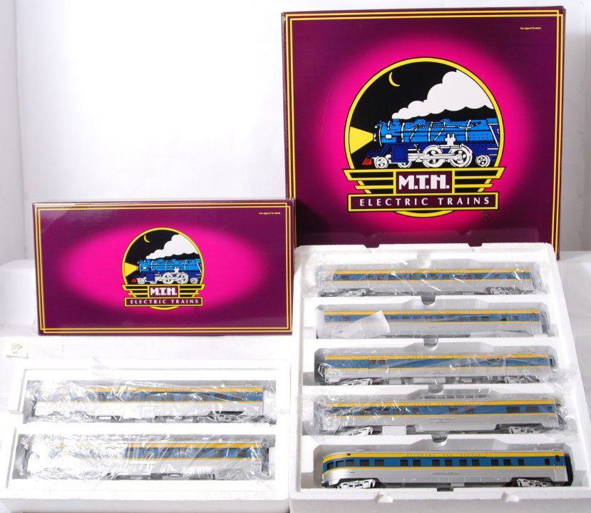 MTH Delaware and Hudson 7 car set: MTH modern O gauge Delaware and Hudson passenger cars in OBs. Seven cars includes 20-6579 five car set and 20-6679 sleeper / diner combo. Cars are C8 with run time.