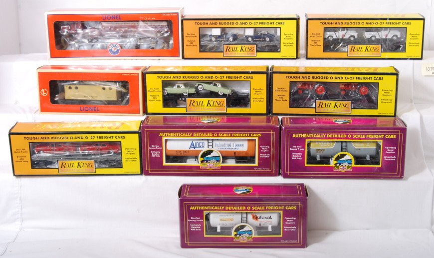 10 MTH and Lionel freight cars 52371, 92011, 9600: Lionel and MTH modern O gauge freight cars in OBs. Ten cars include MTH 96004 Natl. Starch tank, 96002 Vulcan tank, 92011 Airco tank, 9640 Union 76 flat with trucks, 7642 MTH flat with tractors, 7623 