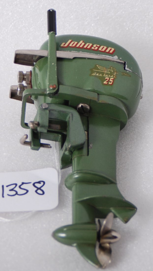1954 Johnson RD-16A Sea Horse 25 battery op.: 1954 Johnson RD-16A Sea Horse 25 battery operated toy outboard boat motor, ding to lower case at cover mount, C7-8.