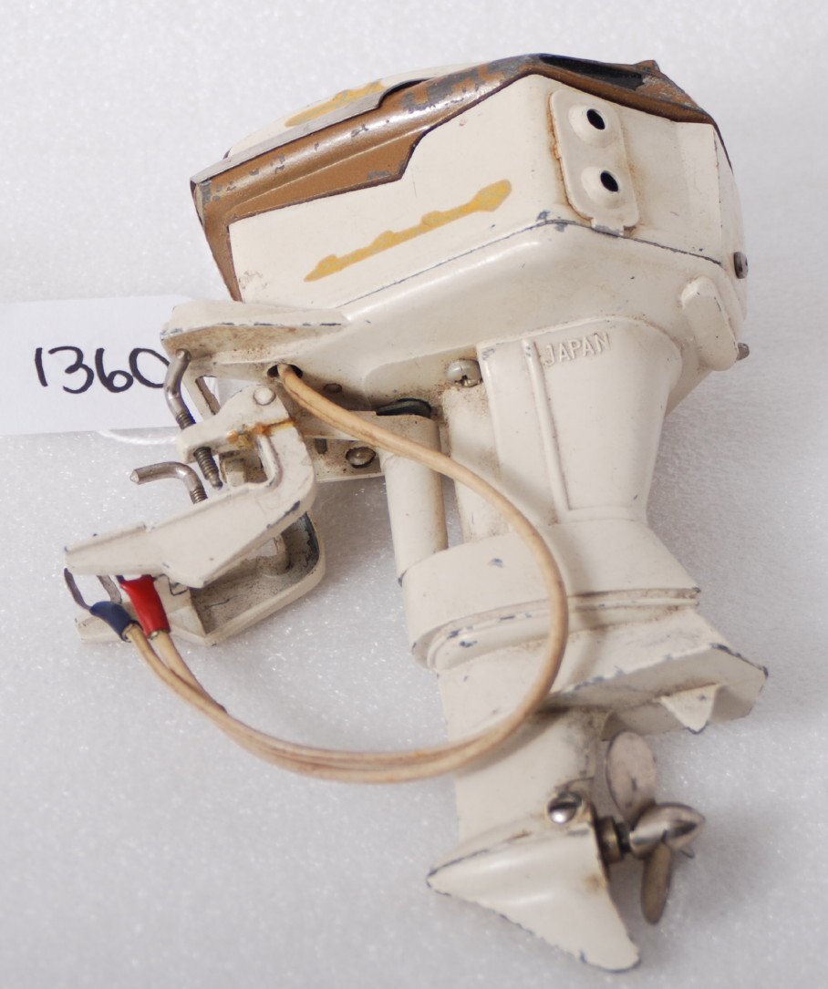 1958 Johnson Super Sea Horse four cyl. 50 battery: 1958 Johnson Super Sea Horse four cylinder 50 hp battery operated toy outboard boat motor, C7. Also present and included but not photographed is a custom made acrylic stand similar to the stand in Lot