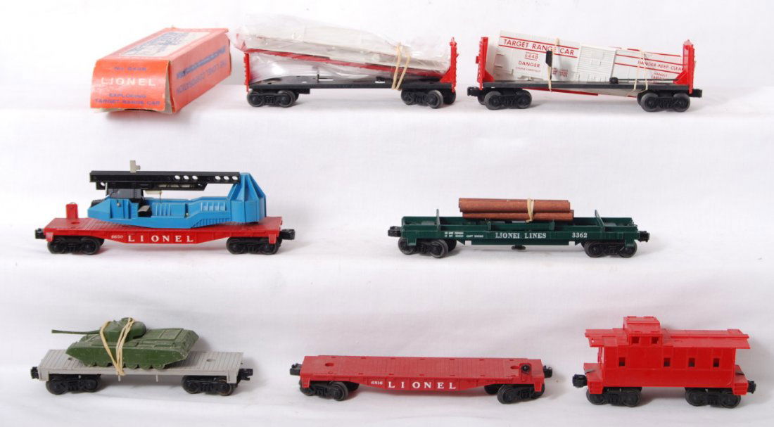 Lionel Postwar military and flat cars: Lionel Postwar O gauge two 6448 exploding boxcars, flat with tank, 3362 lumber car, 6816 flat with no load, 6650 missing missile, unnumbered caboose. C6-7.