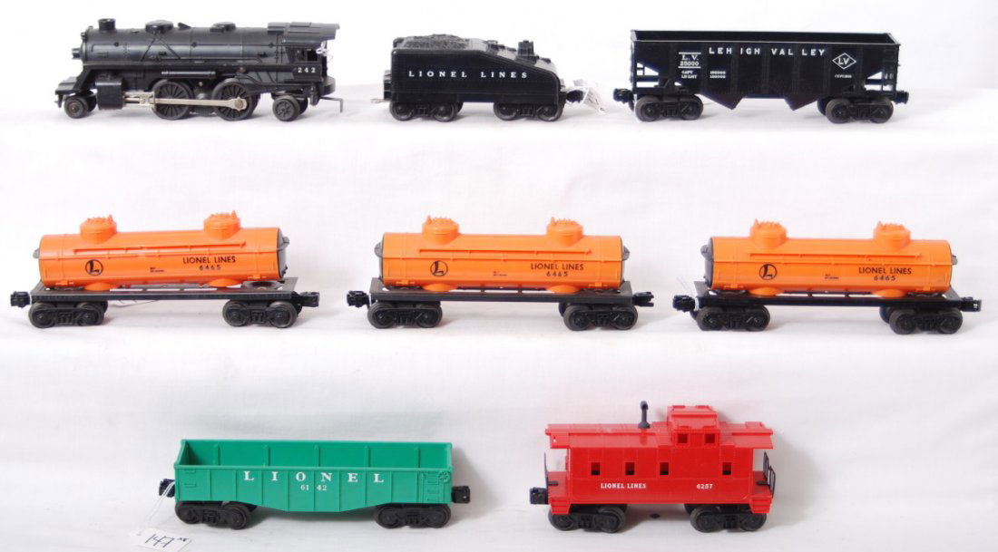 Lionel 242, 6465, 6257, etc: Lionel Postwar O gauge 242 loco with slopeback tender, three 6465 tank cars, black LV hopper, 6142 gondola, and 6257 caboose. C7.