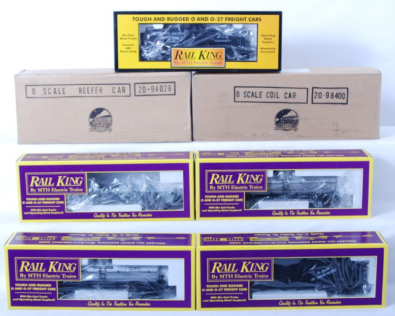 7 Railking freight cars Union Pacific, MTHRRC: MTH Railking modern O gauge freight cars in OBs. Seven cars include 7302 Union Pacific tank car, 7309 Union Pacific tank car, 7302 Union Pacific tank car, 7502 Union Pacific hopper, 7203 Santa Fe gond
