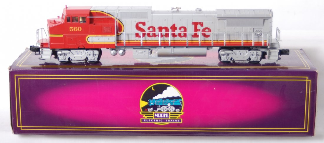 MTH Santa Fe Dash 8: MTH modern O gauge Santa Fe Dash 8 40 diesel locomotive in OB. Loco features dual motors, electronic reverse, and more. C7-8 with light stain on fuel tank.