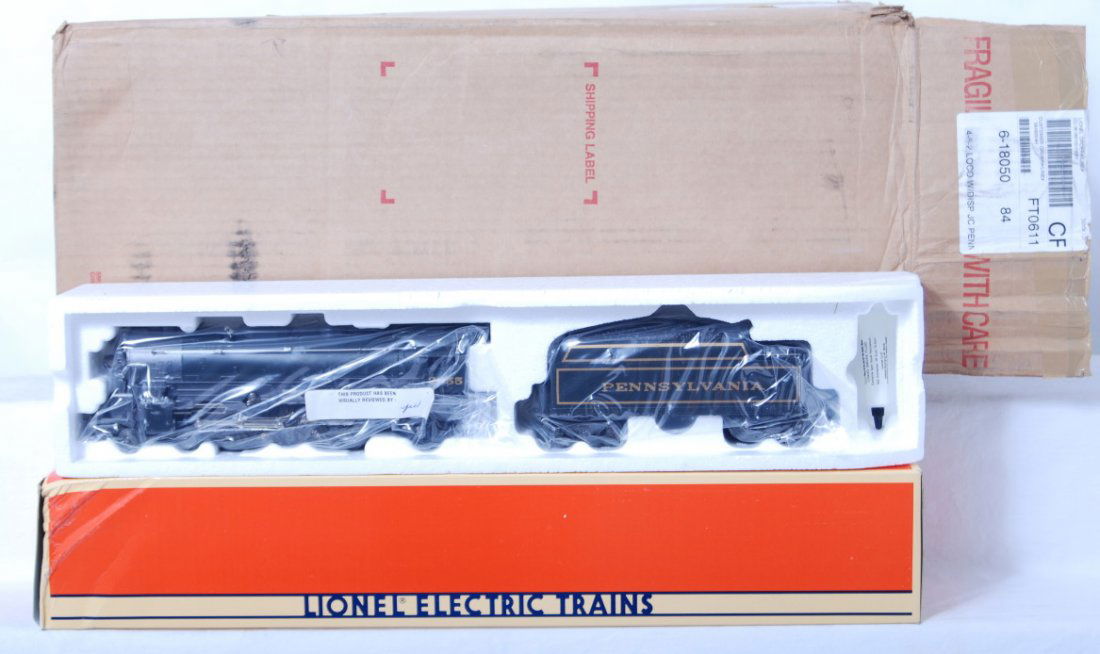 Lionel JC Penney Pennsylvania 4-6-2 with case: Lionel modern O gauge 18050 JC Penney Pennsylvania 4-6-2 loco in OB. Loco also comes with display case. Loco is C9-10. Box has some damage at one end.