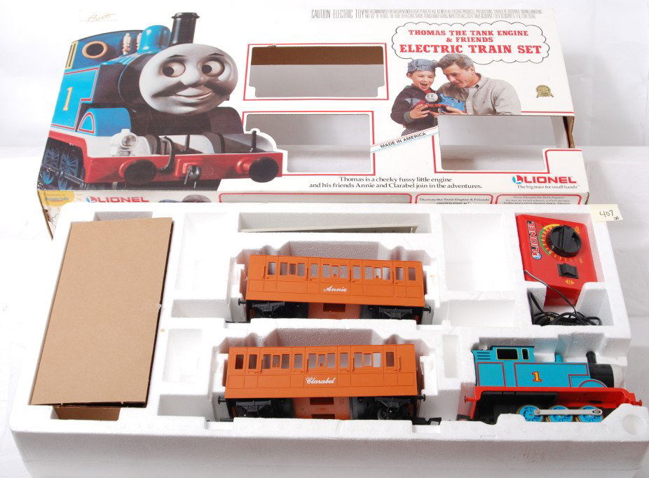 Lionel 81014 Thomas and Friends set: Lionel modern G scale 81014 Thomas and Friends James the Red Engine set with two troublesome trucks. Set is C7-8 with run time and plastic discoloration. Set has track and transformer. OB has light co