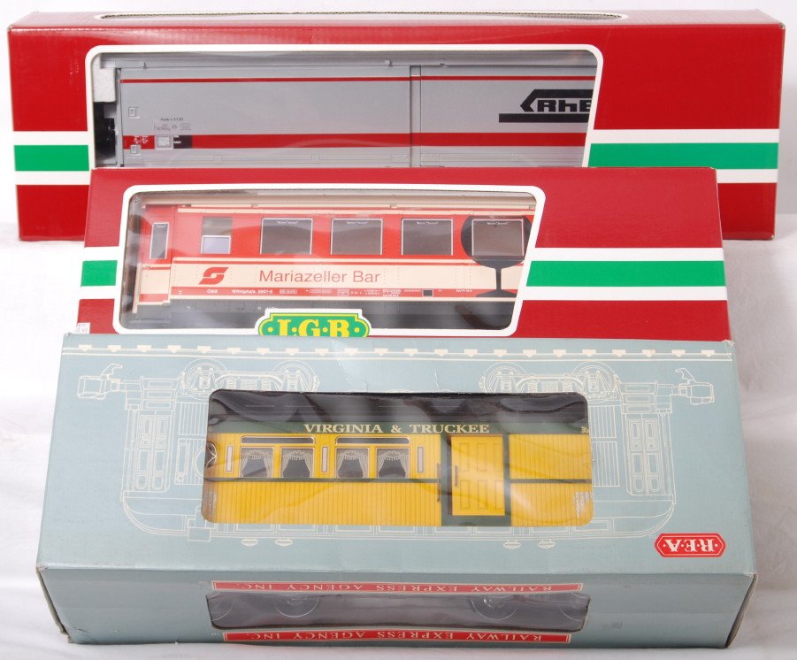 3 LGB and REA cars 41570, 33625, 31103: LGB and REA modern G scale cars. Three cars include 33625 Marizeller Bar coach, 41570 RhB double door boxcar, and REA 31103 V&T coach.