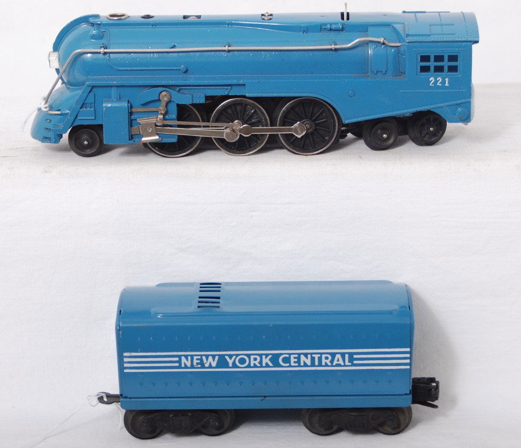 Lionel 221 streamline steam loco and whistle tende: Postwar Lionel O gauge 221 streamline steam locomotive and tinplate whistle tender, both restored in a light blue/Blue Comet color, C6.