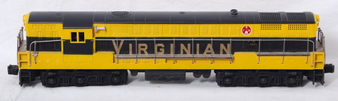 Lionel 2331 Virginian FM Trainmaster diesel loco: Postwar Lionel O gauge 2331 Virginian FM Trainmaster diesel locomotive with very tight hairline at rear screw. A little very light oxidation/discoloration to some walk ways, otherwise C7.