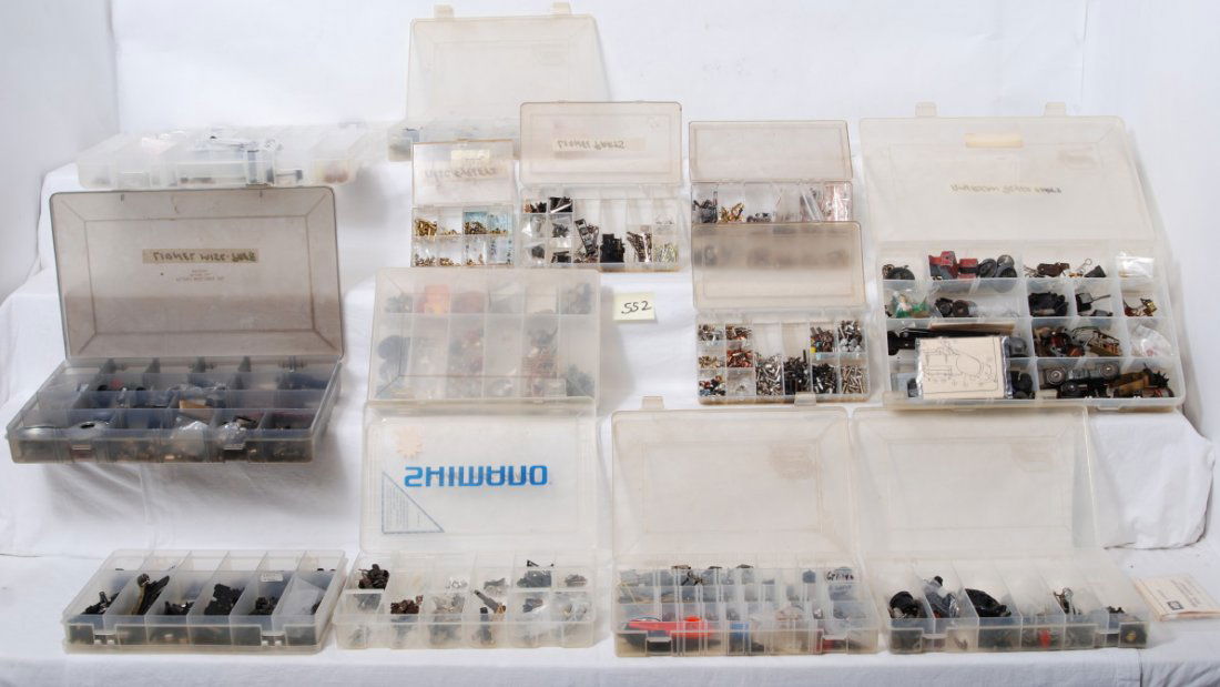 Screws, rivets, armatures, side rods, light bulbs,: Thirteen small plastic divided storage containers with small parts, screws, rivets, armatures, side rods, light bulbs, e-units, wheels, and such, etc. For additional photographs other than the three o