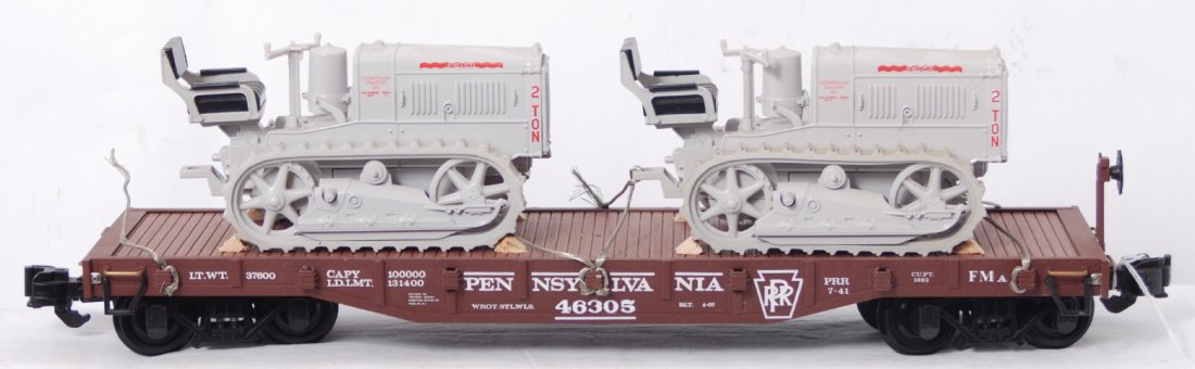 Aristo Craft PRR flatcar with Ertl Caterpillar tra: Aristo Craft PRR flatcar with Ertl Caterpillar traction dozers. Please view the photos of the items in this lot, the items are sold as is shown with no returns.