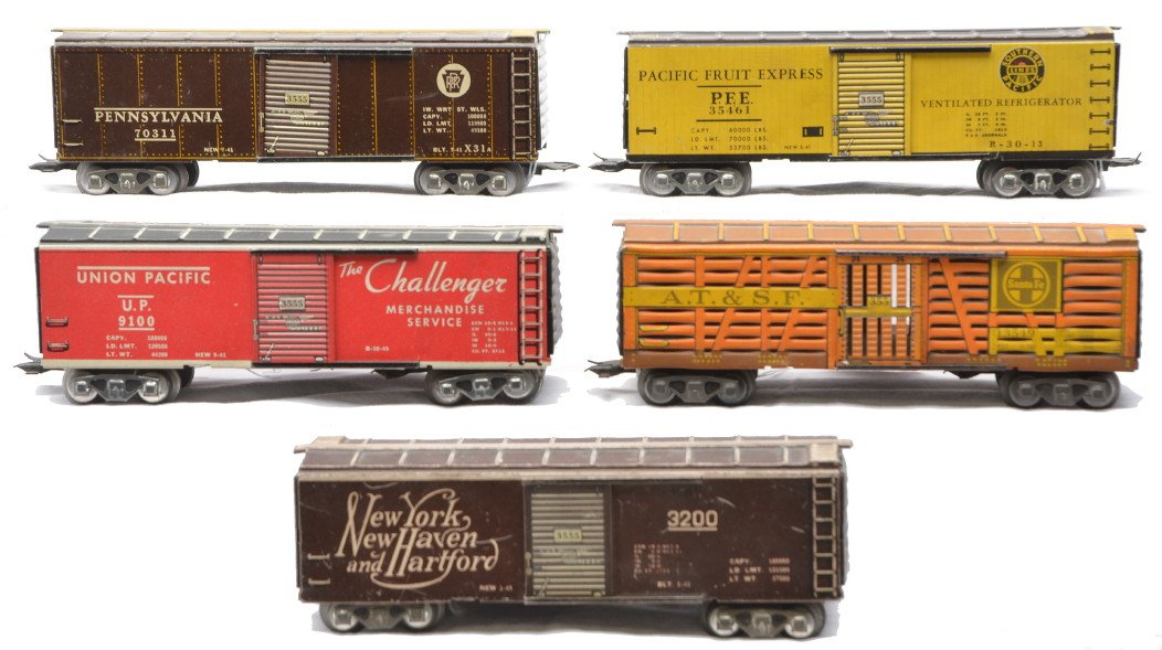 Marx 3/16 Inch 35461 3200 9100 70311 13549: Marx lithographed 3/16 inch scale freight cars including; 35461 Pacific Fruit Express refrigerator car, 3200 New York, New Haven and Hartford boxcar, 9100 Union Pacific boxcar, 70311 Pennsylvania boxc