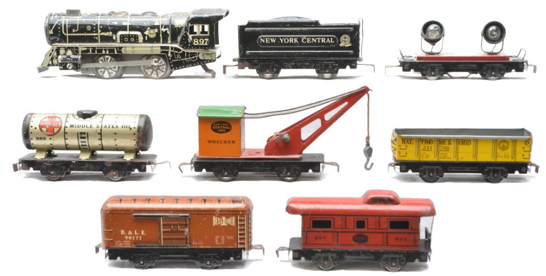 Marx 897 951 241708 90171 553 559 550 694: Marx 897 black and white lithographed 0-4-0 steam wind up loco and a four wheel 951 New York Central tender. Also included are six four wheel lithographed freight cars including; 241708 B&O gondola, 9