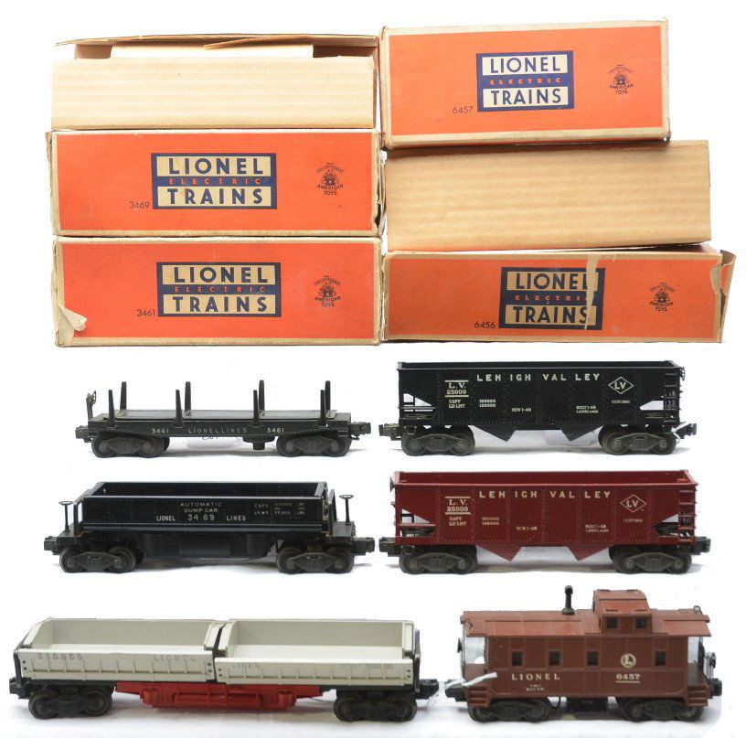 Lionel Freights 3469 3461 6456 6456 3359 6457: Lionel postwar freight cars including; 3469 automatic dumping ore car, 3461 automatic lumber car both in OBs with original cardboard inserts, 6456 maroon Lehigh Valley hopper, 6456 black Lehigh Valley