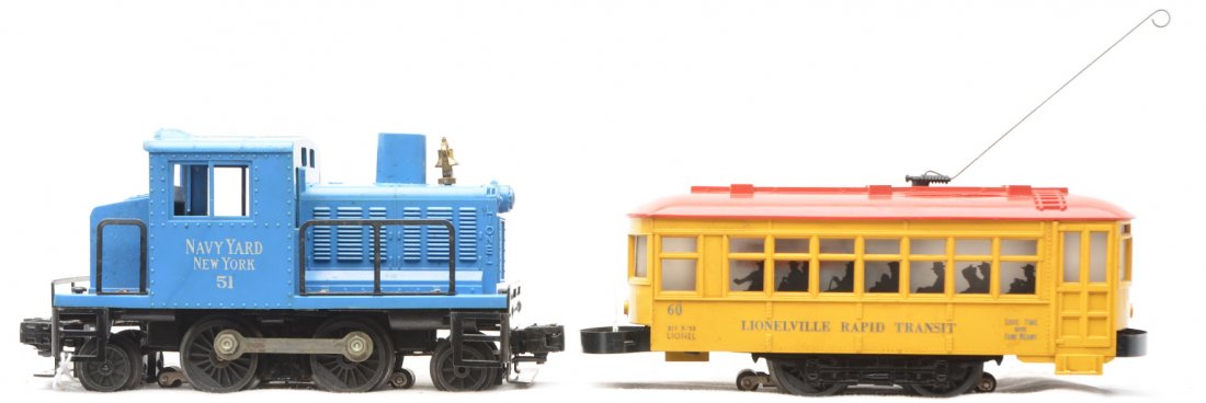 Lionel 51 Navy Switcher 60 Lionelville Trolley: Lionel postwar 51 Navy Yard New York switcher with cracked struts and a 60 Lionelville Rapid Transit trolley with a cracked roof. The 51 is C6 and the 60 is C5.