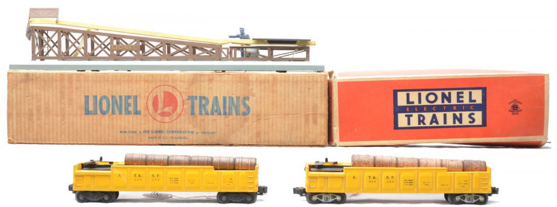 Lionel 362 Barrel Loader 2-3562-50 Barrel Cars OB: Lionel postwar 362 barrel loader with wooden barrels in worn OB. Also included are two 3562-50 yellow operating A.T.&S.F. barrel cars, one with wooden barrels, one in a worn OB. Both cars are missing