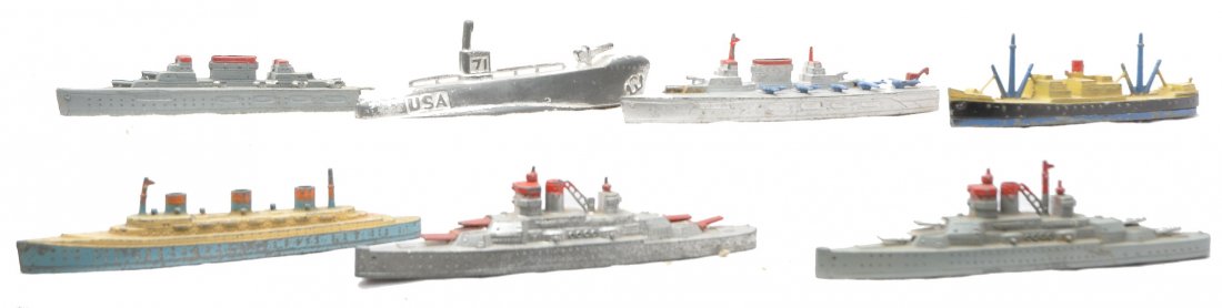 TootsieToy Selection of Ships Manoil Submarine: TootsieToy selection of six ships including; 1037 transport, 1038 freighter, two 1036 aircraft carriers, one that is broken, two 1034 battleships. Also included is a Manoil submarine. The ships show m