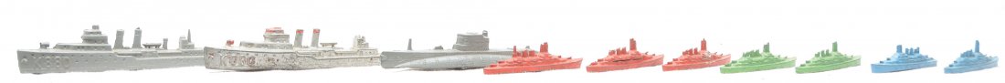 TootsieToy Selection of Ships Midget Series Ships: TootsieToy selection of ships; two 127 destroyers, a submarine top and seven midget series ships, two blue, two green and three red. The ships have moderate paint loss and some of the ships have broke