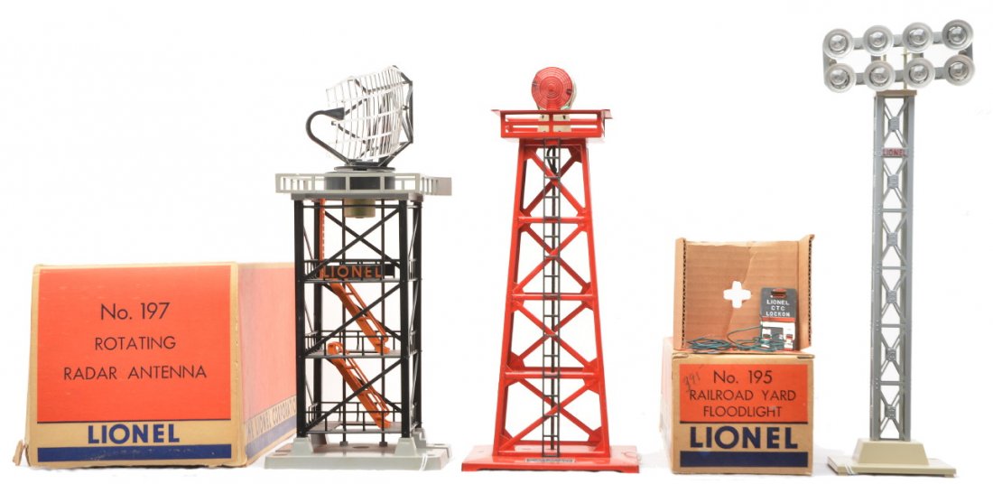 Lionel 195 RR Floodlight 197 Antenna 494 Beacon: Lionel postwar accessories; 195 railroad yard floodlight with CTC lockon, wires and original cardboard insert in worn OB, 197 rotating radar antenna in a worn OB and a 494 red beacon. The 195 and 494 