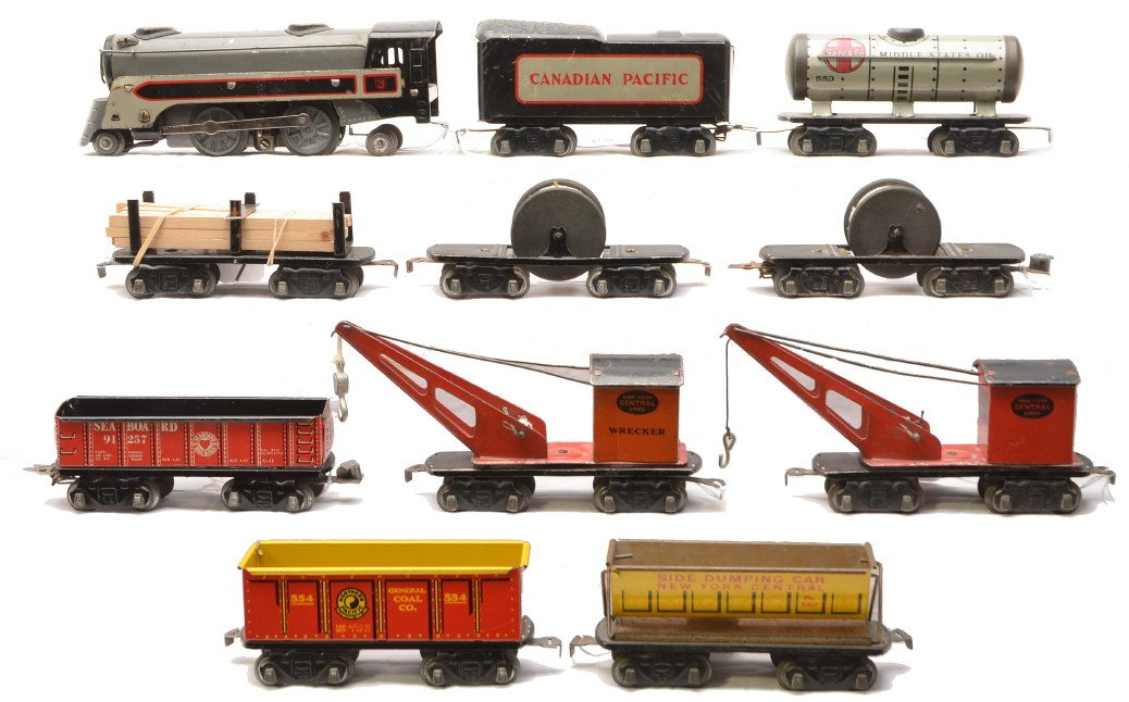 Marx 3000 451 91257 553 554 563 567 2550 2566: Marx lithographed 3000 Canadian Pacific 2-4-2 steam loco and a 451 eight wheel tender with eight wheel lithographed freight cars including; 91257 Seaboard gondola, 553 Santa Fe Middle States Oil tank,