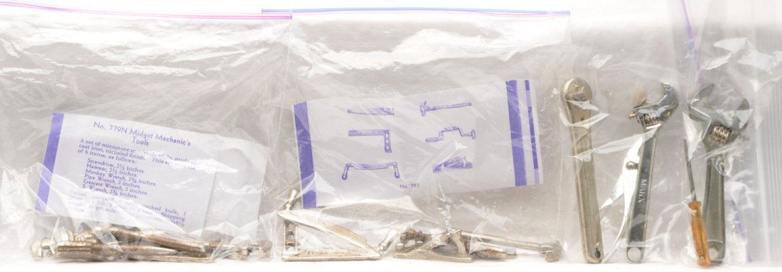 Arcade Midget no. 782 Carpenter 779N Mechanic: Arcade cast iron no. 782 Midget carpenterÕs tool set and a 779N Midget mechanicÕs tool set. Also included are three Marx tools and a screw driver and crescent wrench, manufacturer unknown. Tools are