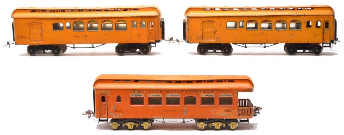 Ives Orange Passenger Cars 187 187 182: Ives prewar wide gauge two 187 orange N.Y.C. & H.R. Buffet cars with four wheel trucks and no journals. Also included is an orange 182 observation with six wheel trucks and brass journals. The cars ha