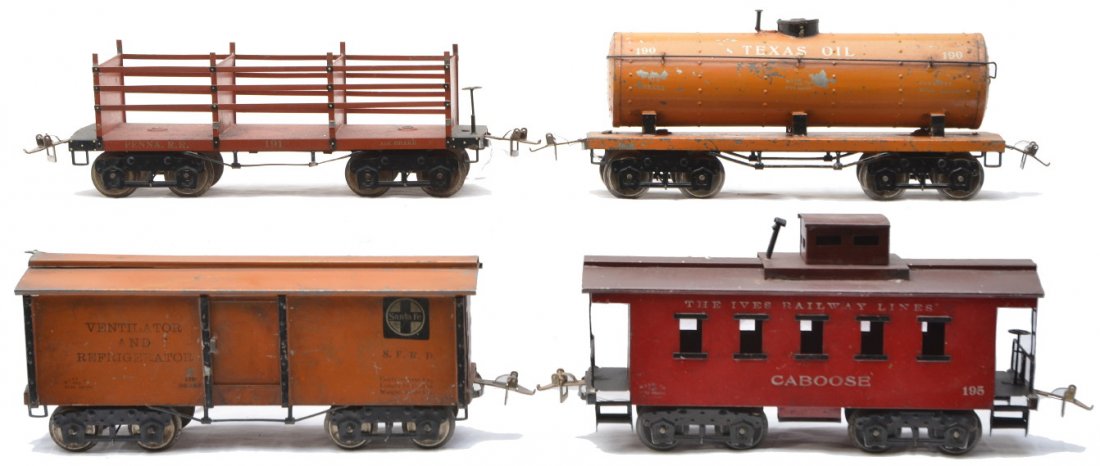 Ives Wide Gauge Freight Cars 190 191 192 195: Ives prewar wide gauge freight cars; 190 orange Texas Oil tank car, 191 red Penna. R.R. Coke car missing one side slat, 192 red brown Santa Fe merchandise car and 195 red caboose with brown roof. Cars