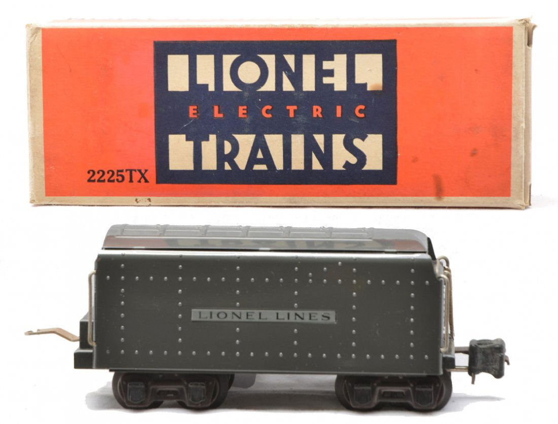 Lionel 2225TX Gunmetal Tender MINT Boxed: Lionel prewar O gauge 2225TX gunmetal gray tender in OB. The coupler is missing the pin and draw bar and has some corrosion. Tender has never been run and the paint is bright and shiny. Tender is C9.