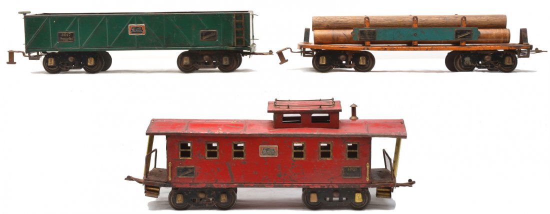 Am Flyer Prewar Freight Cars 4017 4022 4021: American Flyer prewar freight cars with black flex trucks and brass journals including; 4017 green sand car, 4022 orange machinery car with turquoise side bars and reproduction wood load and a 4021 re