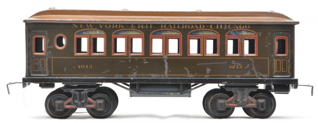 Scarce Bing 1043 Litho Pullman NY-Erie RR-Chicago: Scarce Bing 1 gauge 1043 lithographed Pullman lettered NEW YORK-ERIE RAILROAD-CHICAGO above the windows. The roof and air tanks appear to have been repainted. Car is C5.