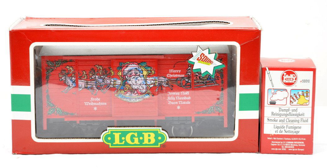 LGB 43352 Christmas Car wSound 50010 Fluid OBs: LGB G scale 43352 Christmas boxcar with sound in OB, C8. Also included is a bottle of 50010 smoke and cleaning fluid in OB.