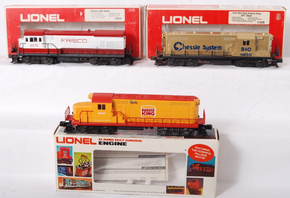 3 Lionel diesel locomotives 8359, 8160, 8571: Lionel modern O gauge diesel locomotives in OBs. Includes 8359 Chessie GP-7, 8160 Burger King GP-20, and 8571 Frisco U36B. Locos are C8 with run time. A few very small stains on the shell of the Chess