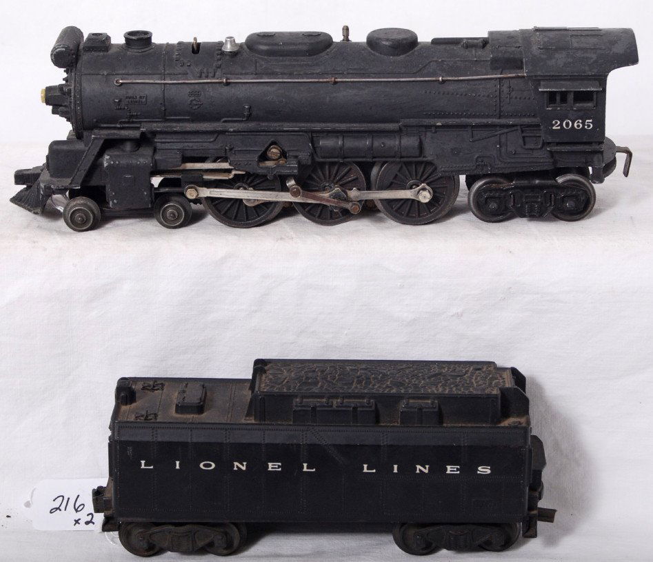 Lionel 2065 steam loco and whistle tender: Postwar Lionel O gauge 2065 steam locomotive with repainting and solder repaired trailing truck mount, C5-6. Unnumbered whistle tender with broken front coupler and rewired, looks C6.