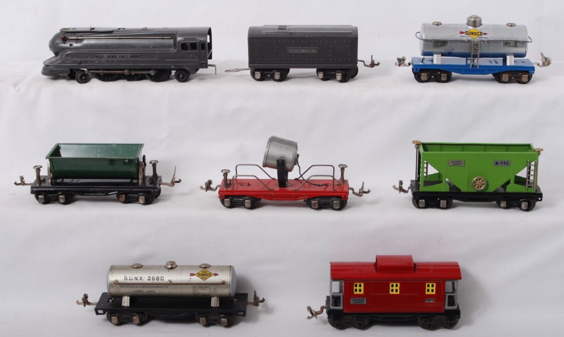 Lionel 1668E & tender, 620, 654, 659, 563, 2680, 6: Prewar Lionel O gauge 1668E streamline steam locomotive and unnumbered tender with 620 searchlight car, 654 Sunoco tank, 659 dump car, 563 hopper, 2680 Sunoco tank, and 657 caboose. Trains look C5-6 w