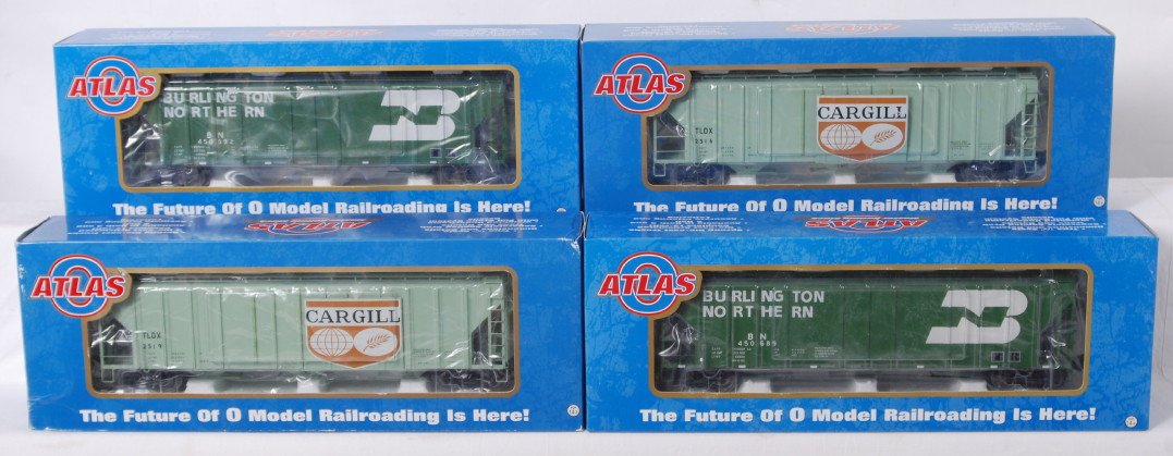 4 Atlas O PS-4427 low side hoppers Cargill BN: Atlas modern O gauge PS-4427 low side hoppers in OBs. Four cars include 6376-9 and 6376-10 Burlington Northern and 6346-3 and 6346-4 Cargill C9-10.