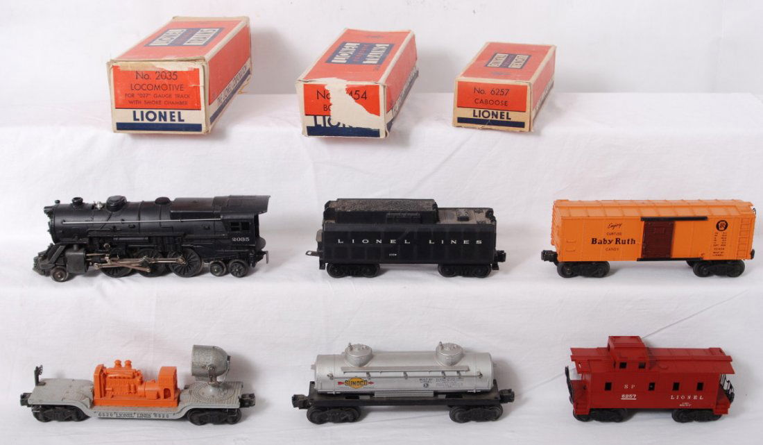Lionel 2035, 235W, X2454, 6520, 6465, 6257: Postwar Lionel O gauge 2035 steam locomotive w/smoke chamber, 235W whistle tender (missing a front step), X2454 Pennsylvania Baby Ruth boxcar (missing a step on each side), 6520 searchlight light, 646