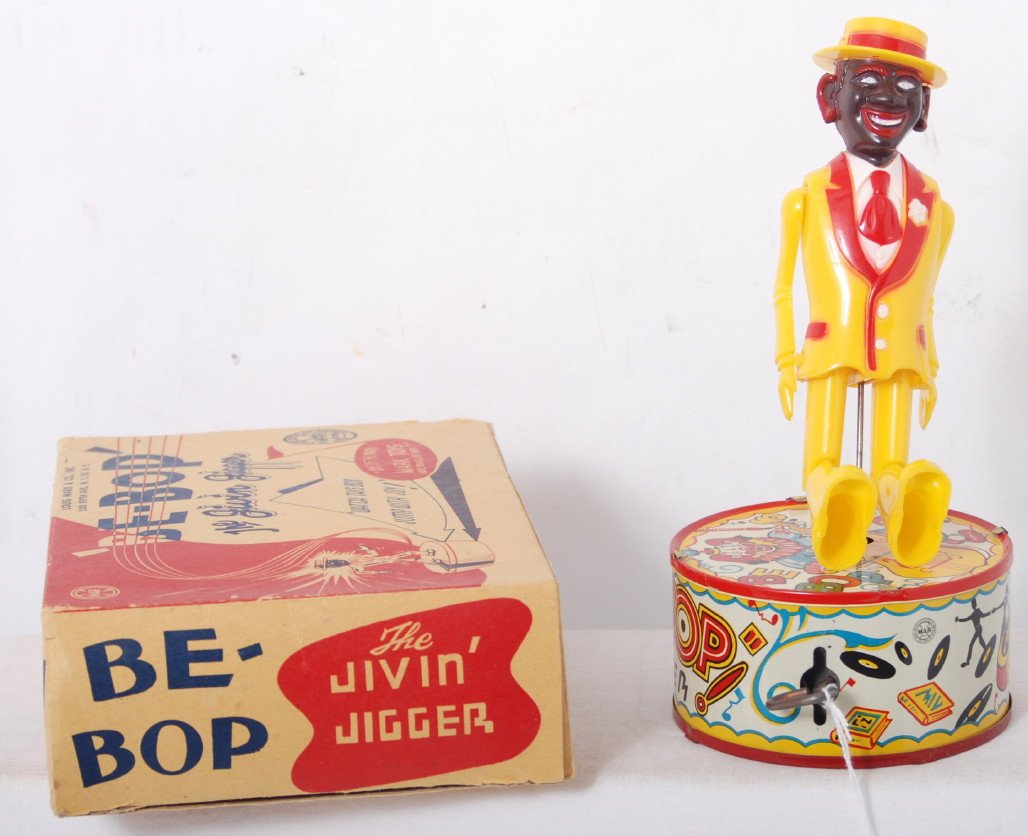 Marx Be-Bop The Jivin Jigger in OB, mechanical toy: Marx tinplate and plastic windup mechanical toy in original box. Be Bop The JivinÕ Jigger, ÒSee him go on heel and toeÓ. Toy looks C9 area with $1.49 price on top of hat. Box looks C8 area with no 