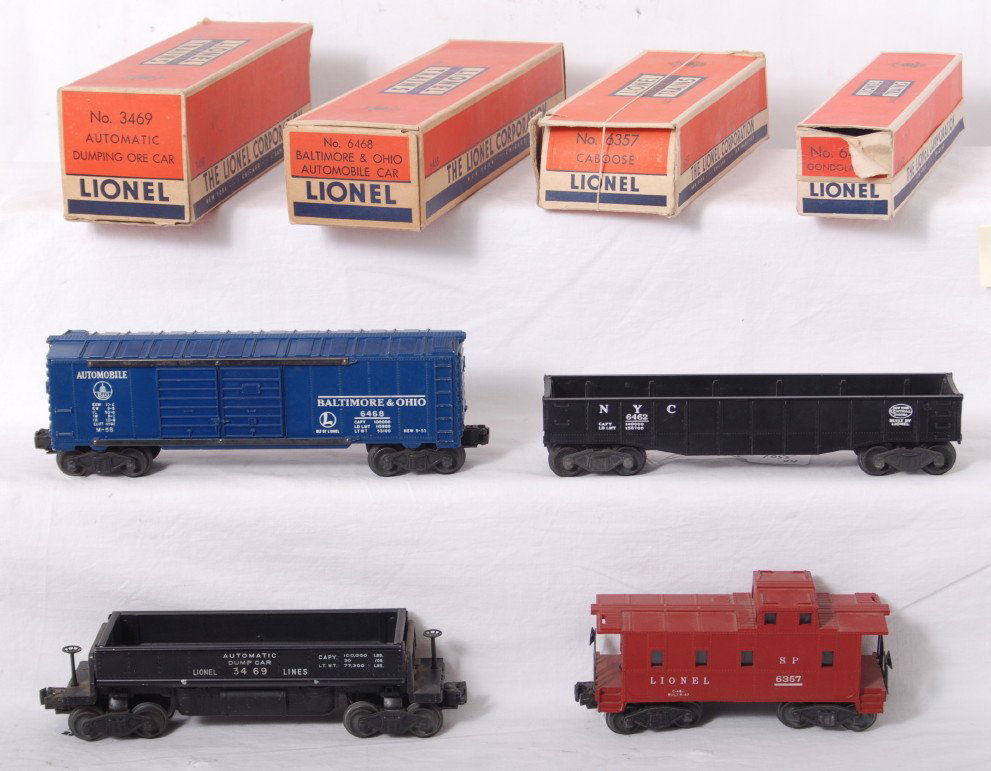 Lionel 6468, 3469, 6462, 6357 in OB: Postwar Lionel O gauge 6468 Baltimore and Ohio boxcar, 3469 automatic dump car, 6462 New York Central gondola, and 6357 SP type caboose, C6. 6468 OB looks C8, others have missing flaps and such.