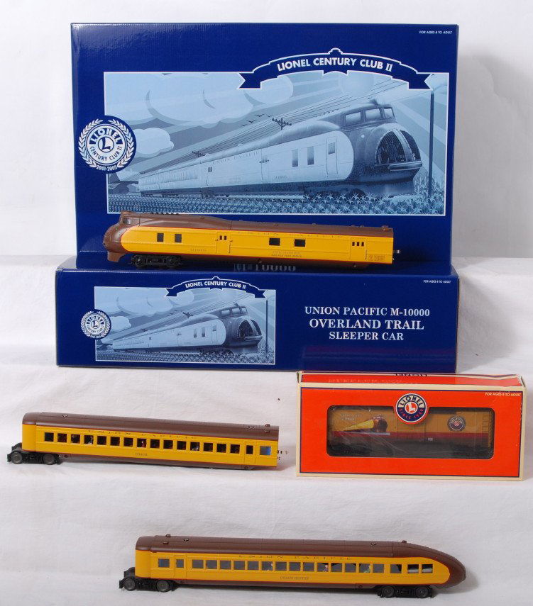 Lionel CCII Union Pacific M-10000 and add ons: Lionel modern O gauge Century Club II Union Pacific M-10000 streamliner in OB. Catalog number is 51007. Loco features TMCC, Railsounds, smoke, Electrocouplers, and much more. Also included is 51249 ad