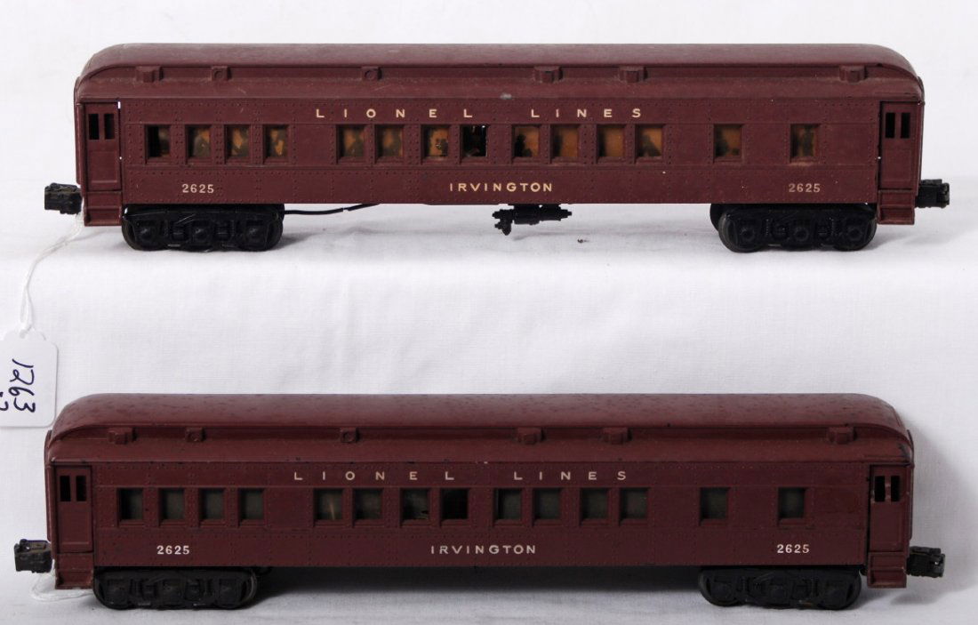 Two Lionel 2625 Irvington Pullman passenger cars: Postwar Lionel O gauge 2625 Irvington Pullman passenger coach, one has a broken shell and is sold as is shown with no returns. Other has silhouette window inserts, C6.