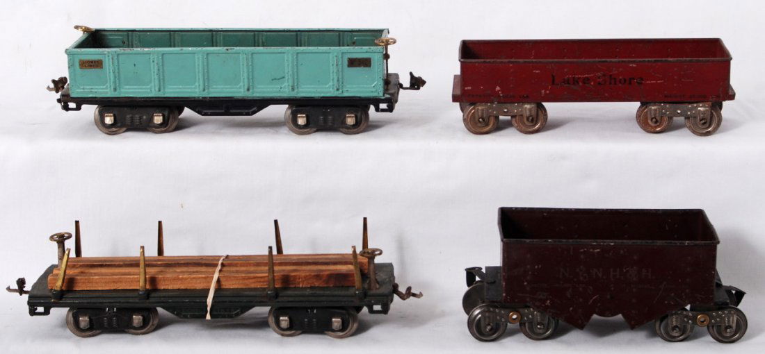 Lionel ore car, Lake Shore, 512, 511 standard gau: Prewar Lionel standard gauge 511 flat with lumber, 512 gondola, Lake Shore gondola, and NYNH&H ore car, C4-5, some repainting.