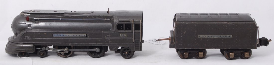 Lionel 238E Pennsylvania steam loco and 265W tend: Prewar Lionel O gauge 238E Pennsylvania streamline steam locomotive and 265W whistle tender. Train should clean and polish to look C6 area. Some light surface rust on some parts. Tender appears to hav