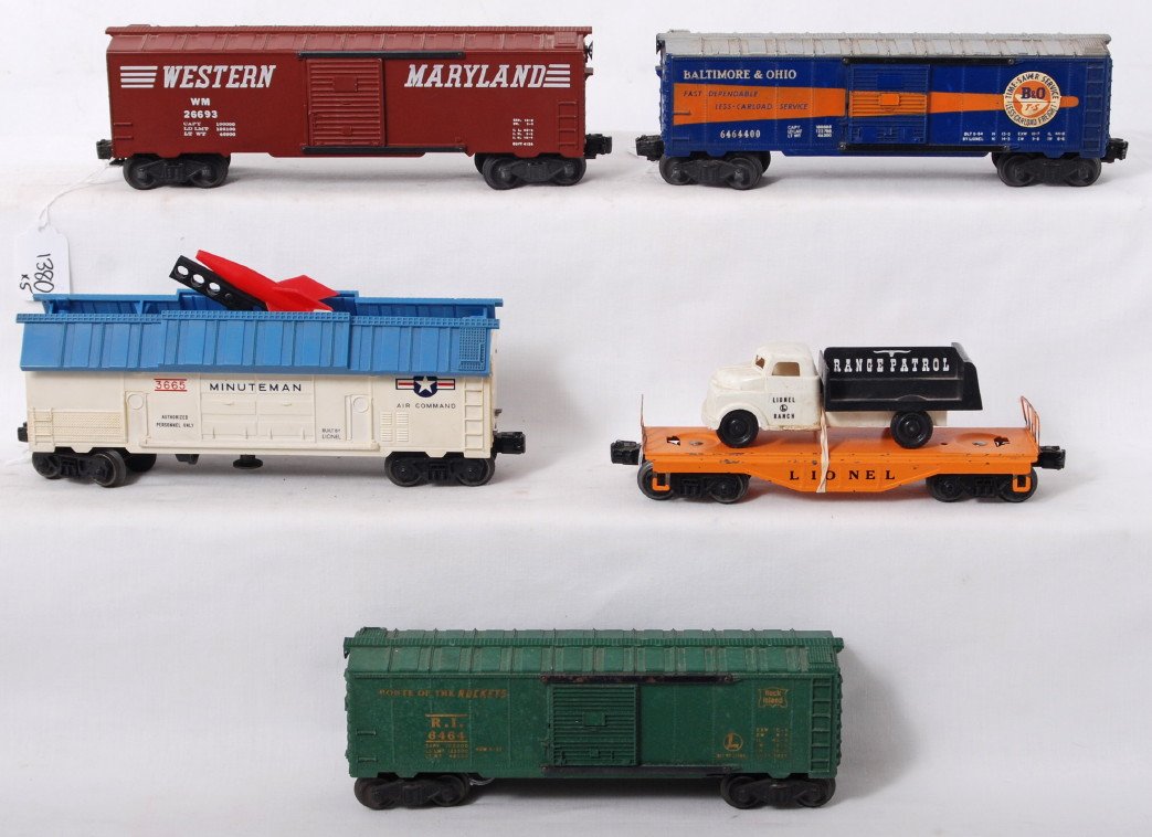 Lionel 3665, 6464-400, 6464-75, 6151, KMT W.M.?: Postwar Lionel O gauge 3665 Minuteman rocket launching car with light blue hatches, clean and bright C6. 6464-400 Baltimore and Ohio boxcar, low C6. 6464-75 Rock Island boxcar surface rust on undersid