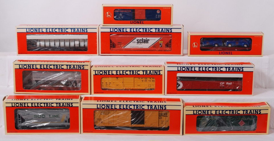 10 Lionel freight cars 16985, 17107, 17400, etc: Lionel modern O gauge freight cars in OB. Ten freight cars include 16985 Eastwood flat with Ford trucks, 6233 Canadian Pacific flat49242 UPS flat with trailer, 29200 LRRC boxcar, 15003 GB&W boxcar, 17