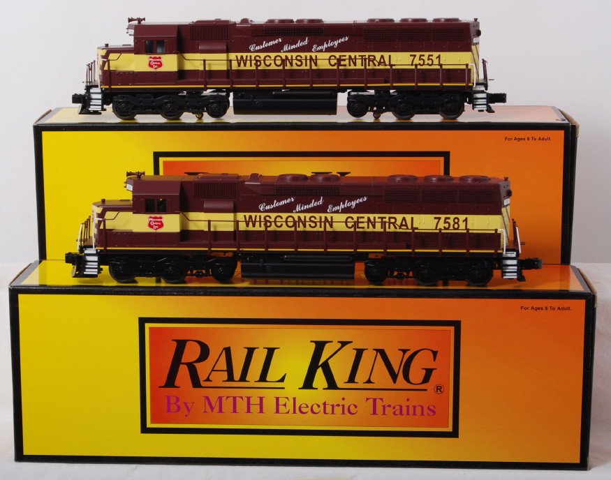 Railking Wisconsin Central SD-45 pair with Proto 2: MTH Railking modern O gauge 30-2361-1 and 30-2361-3 Wisconsin Central SD-45 diesel locomotives in OBs. One powered one dummy. Powered unit features Protosound 2.0, DCS control, Protosmoke, Protocouple