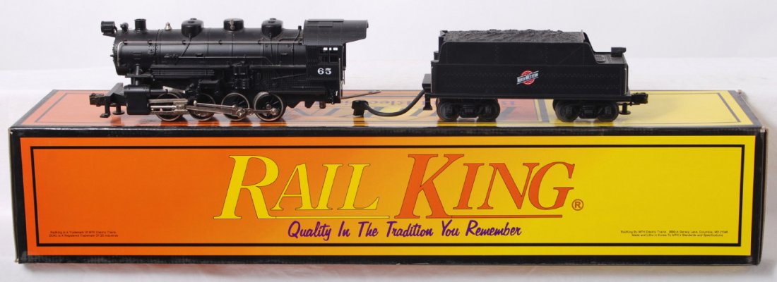 Railking Chicago and Northwestern 0-8-0: MTH Railking modern O gauge RK-1112L steam locomotive in OB. Loco features smoke, whistle, and more. Loco is C7-8 with run time and has some light spotting from dirt. Should clean.